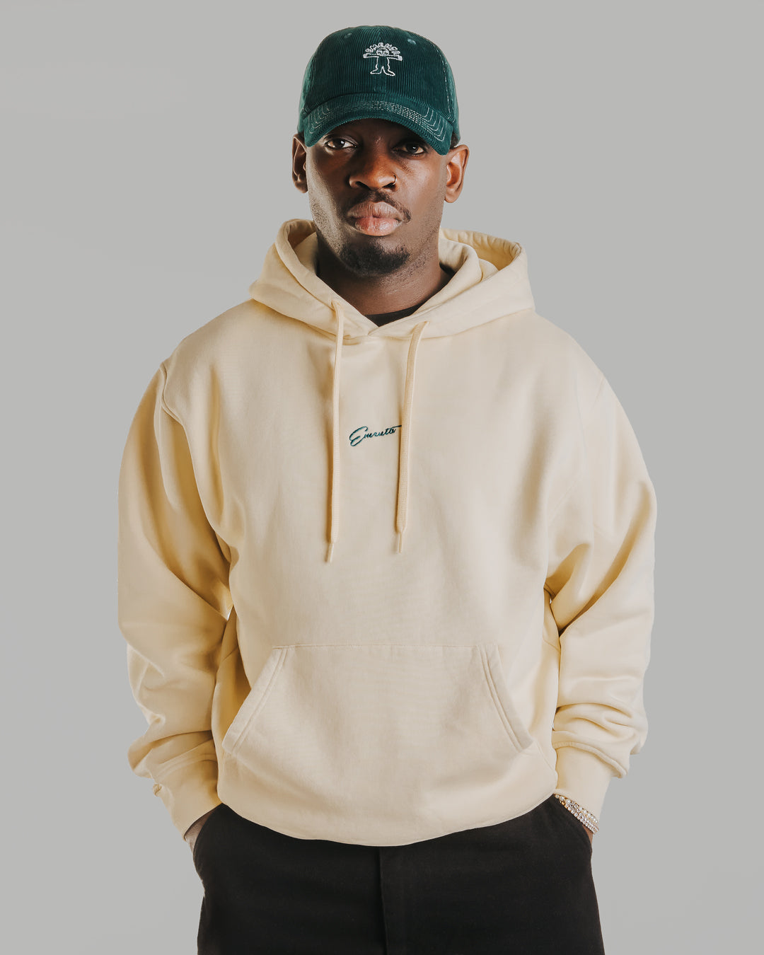 A heavyweight off-white hoodie crafted from 100% cotton with a durable 520gsm fabric that maintains its structure over time. Designed for comfort and longevity, it features a relaxed fit, ribbed cuffs and hem, and a kangaroo pocket. The front showcases an embroidered Ementa signature logo, while the back is detailed with an intricate cocktail design.

Made in Portugal.