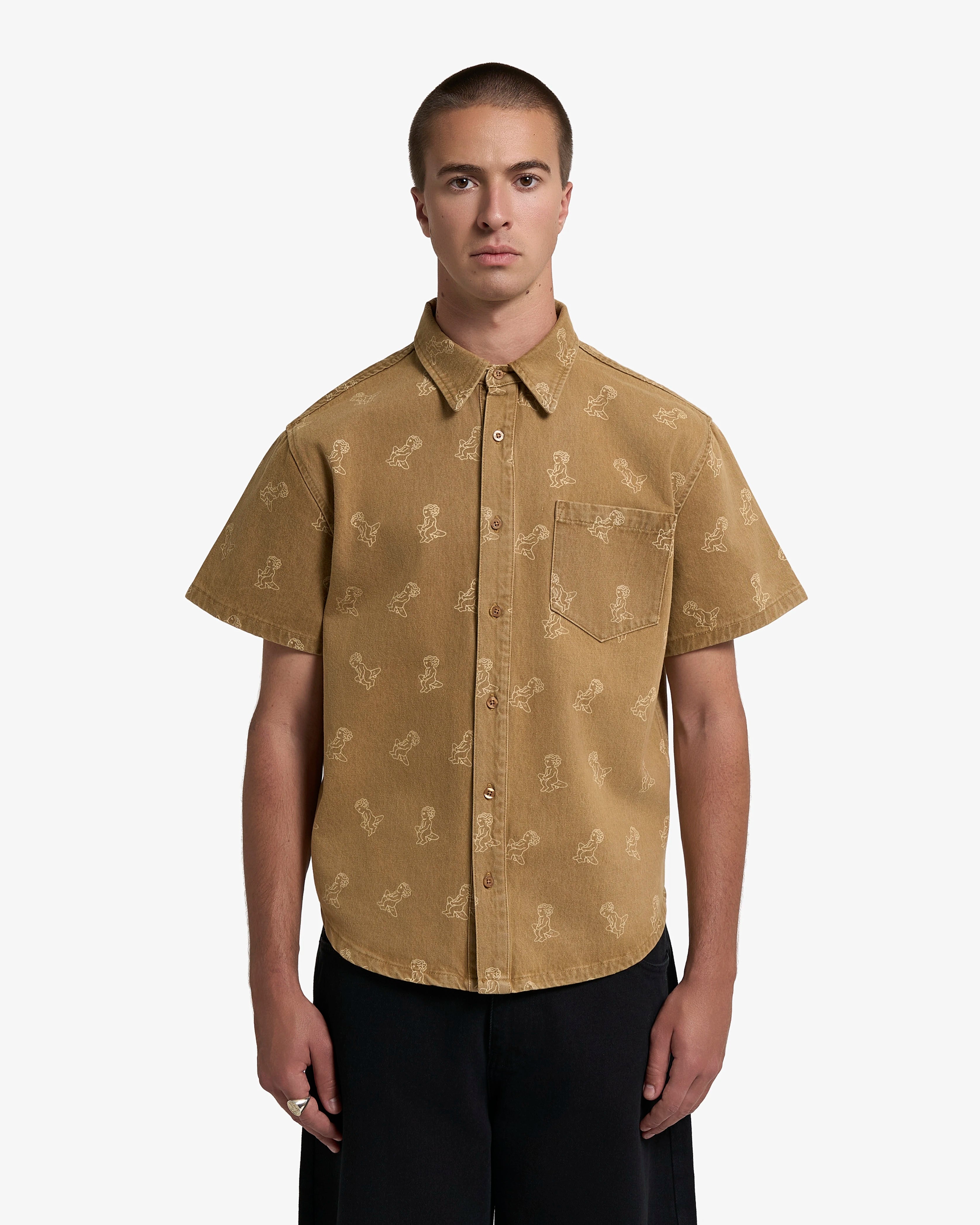 Sand washed denim with all-over Ikon logo
Pair with the matching Emodi Kit Shorts for a complete look
Made from 100% cotton for a soft, breathable feel
Short-sleeved construction with a single chest pocket
Button front closure with tonal stitching
Slightly dropped shoulders for a relaxed silhouette
Unisex design&nbsp;
Cold wash only