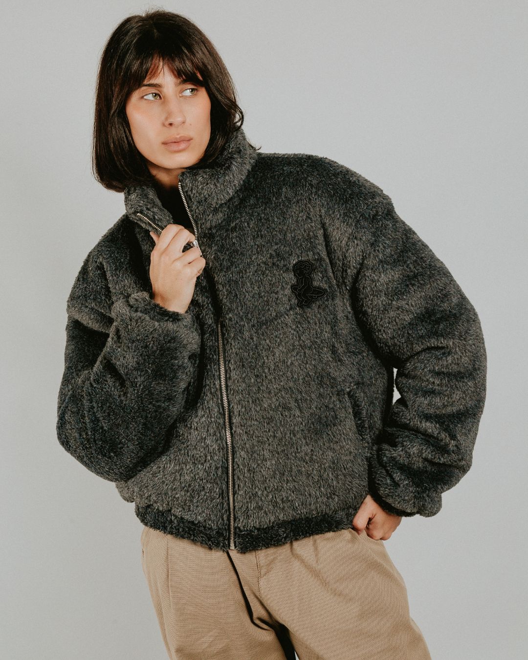 The Ikon Fur Jacket features a soft grey fur exterior and diamond stitching on the inside. The jacket also has the Ikon logo embroidered on the back, along with a black corduroy interior for added detail.

It includes adjustable elasticated wrists and hips for a more tailored fit, along with two exterior pockets and one interior pocket for storage.