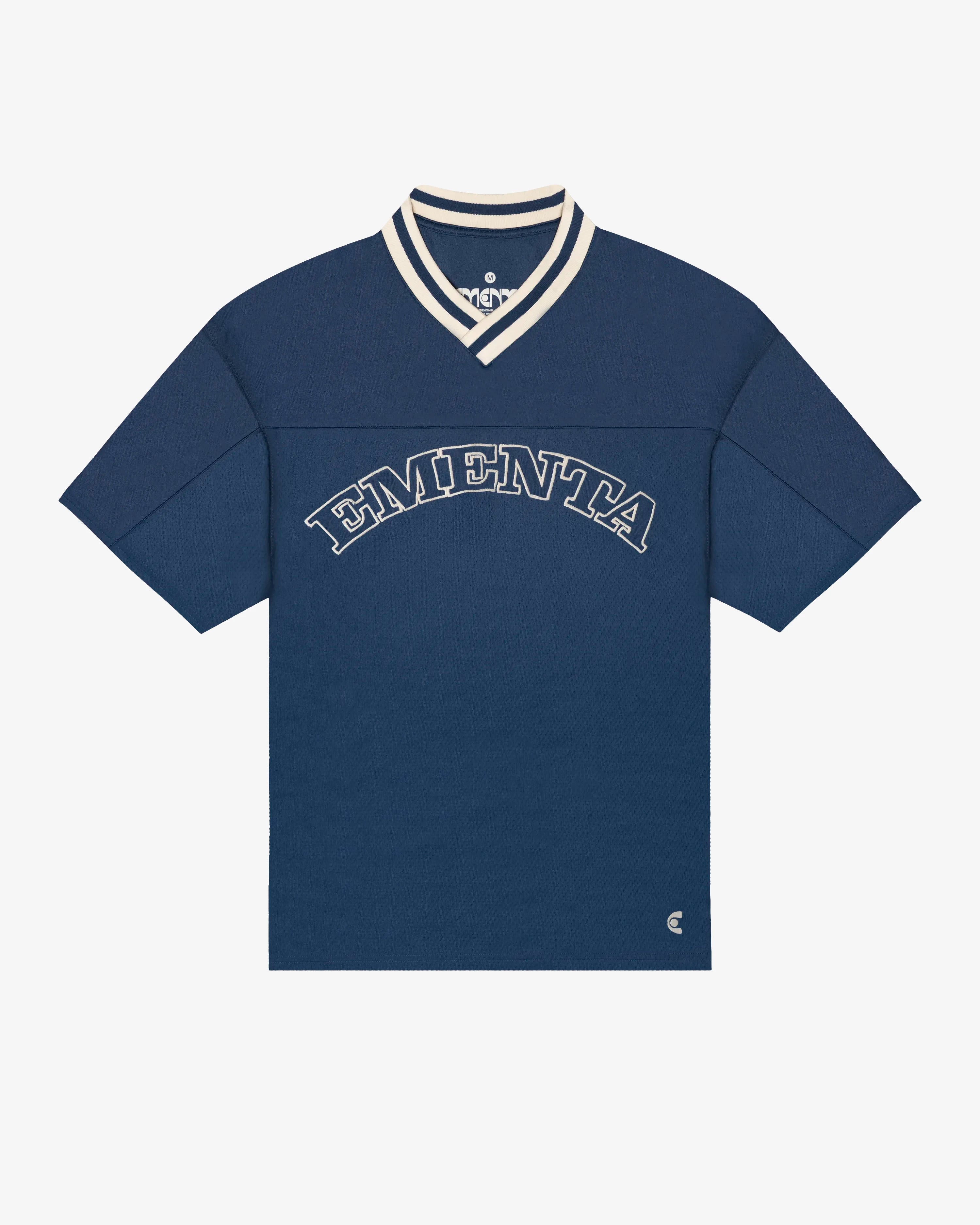 Breathable mesh fabric on the lower half, cotton-poly blend on the upper half
Oversized fit
Navy color with off-white accents
Large 'EMENTA' embroidery on the chest, small branded detail embroidered on the bottom right
V-neck collar with double green stripes
Oversized sleeves for a relaxed silhouette
Part of a kit – matching shorts available online
Machine washable