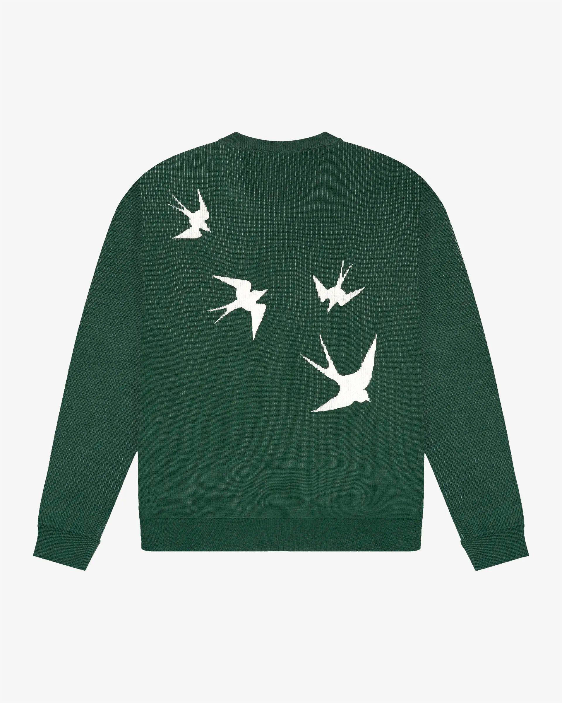 Double-knit cotton with a dense, structured surface and consistent weight
Relaxed straight fit with natural width through body and sleeves
Graphic print on the back with “Lisa” design, inspired by Lisbon’s classic swallows
Knit-in Ementa logo graphic on the front
Pre-washed to stabilize fabric and limit dimensional change
Made in Portugal from breathable cotton yarn
Machine wash cold, dry flat to maintain knit structure