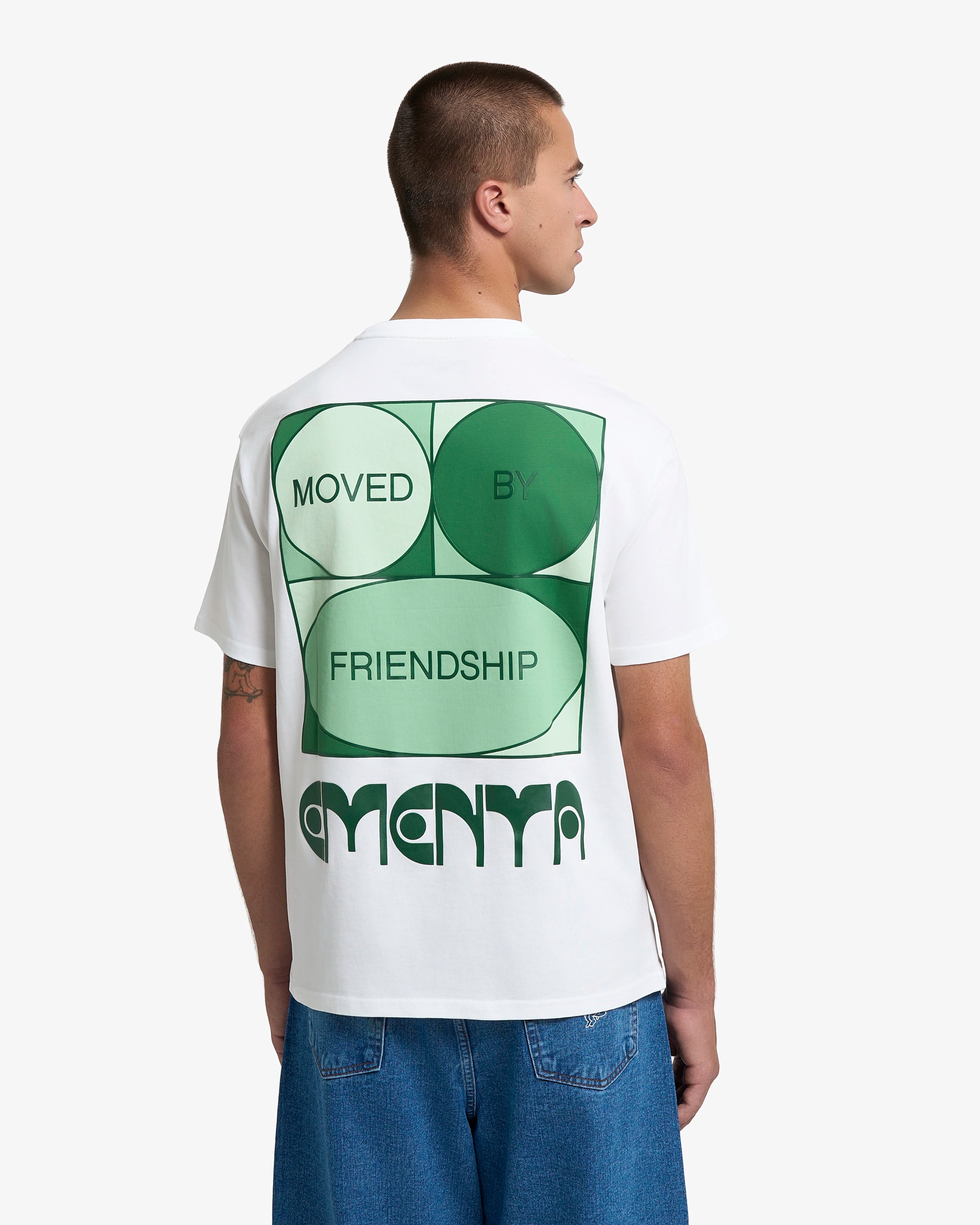 100% Cotton (260gsm)
Heavyweight cotton fabric with soft hand-feel
Boxy, relaxed fit with dropped shoulders
Ribbed crewneck collar
Screen-printed graphic on front and back
Artwork celebrates friendship and unity
"EMENTA© Moved By Friendship" motto on the back
Double-stitched hems for durability
Made in Portugal