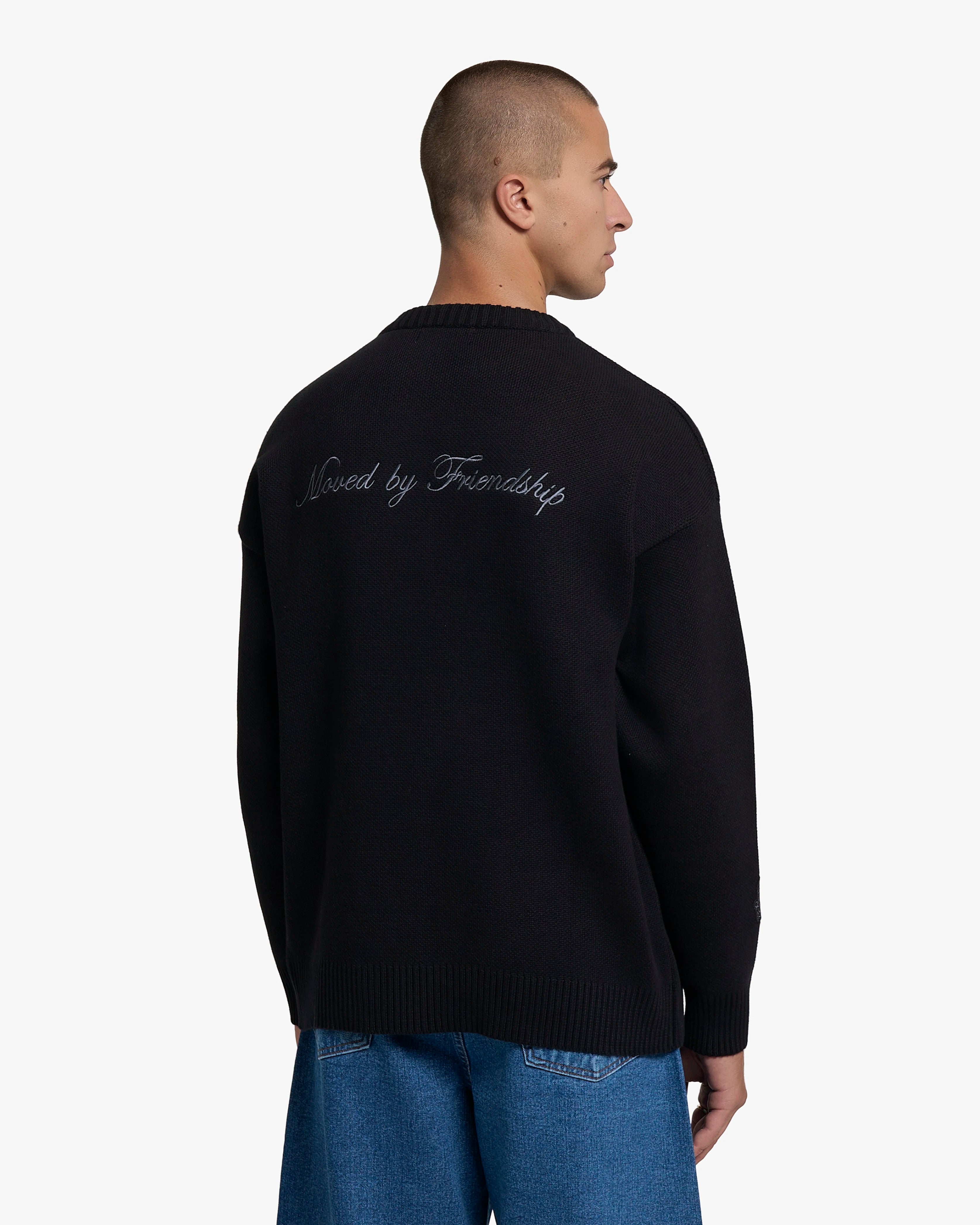 Knitted crewneck sweater designed for everyday wear and layering
100% cotton knit with a structured texture and soft hand feel
Regular fit with ribbed collar, cuffs and hem
‘Moved By Friendship’ motto embroidered in grey across the back
Black colour
Machine wash cold. Do not tumble dry
Made in Portugal