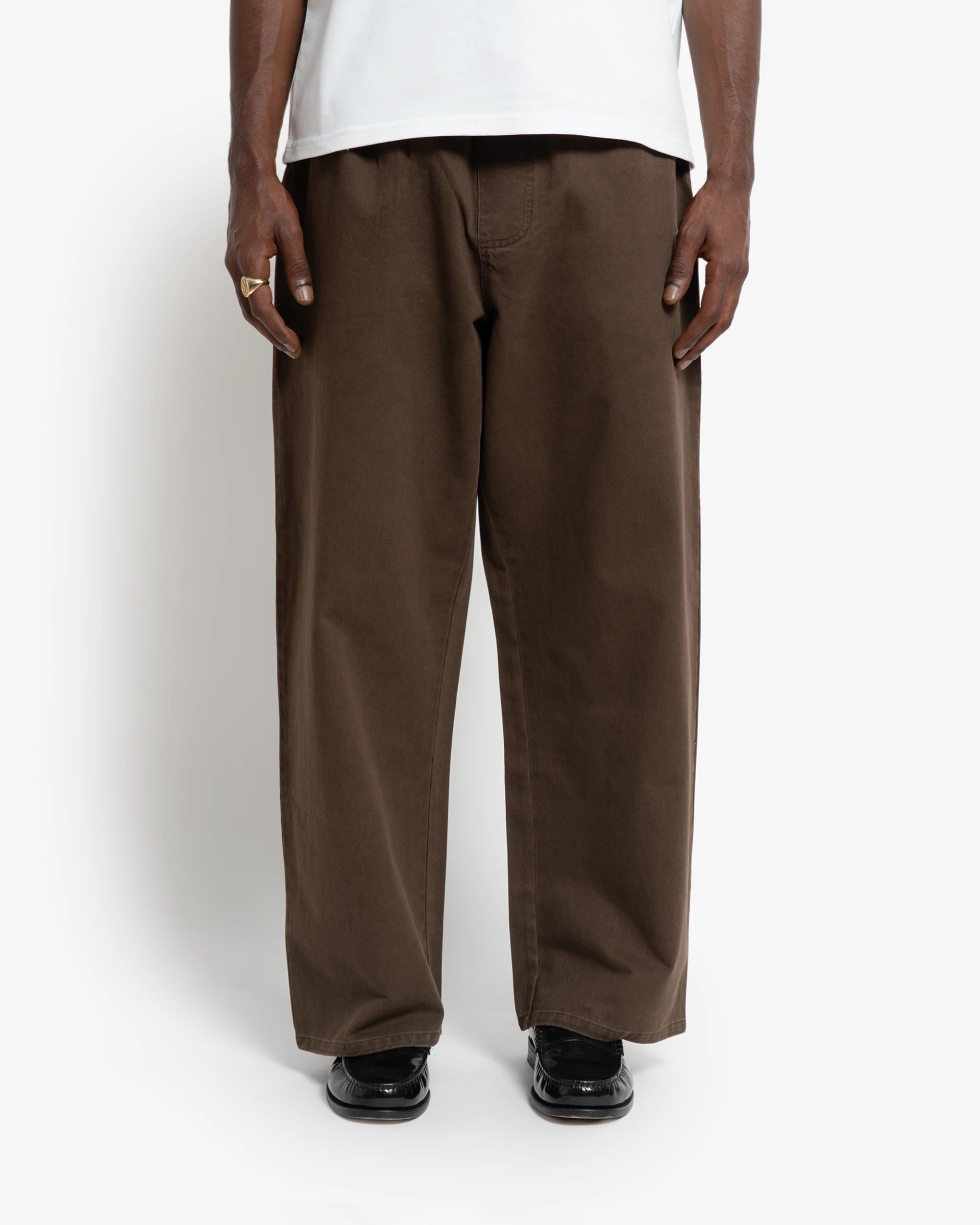 Front view of chocolate cotton twill elastic pants with Baby Stamp embroidered back pocket